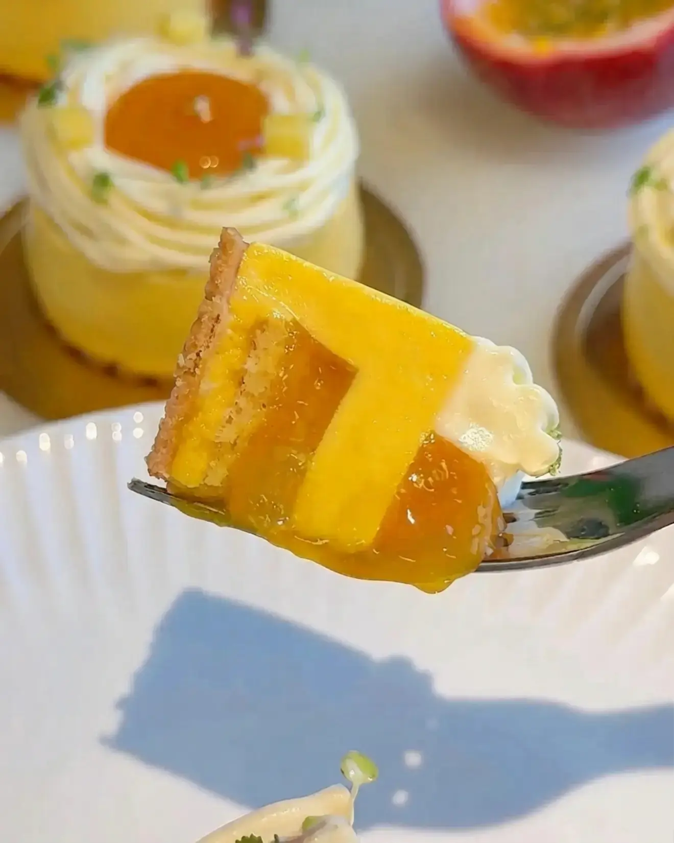 Mango Passion Fruit Coconut Entremet, With mango coconut mousse, mango passion fruit compote, vanilla sponge, passion fruit cremeux, and lime whipped ganache