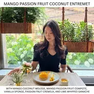 Mango Passion Fruit Coconut Entremet, With mango coconut mousse, mango passion fruit compote, vanilla sponge, passion fruit cremeux, and lime whipped ganache